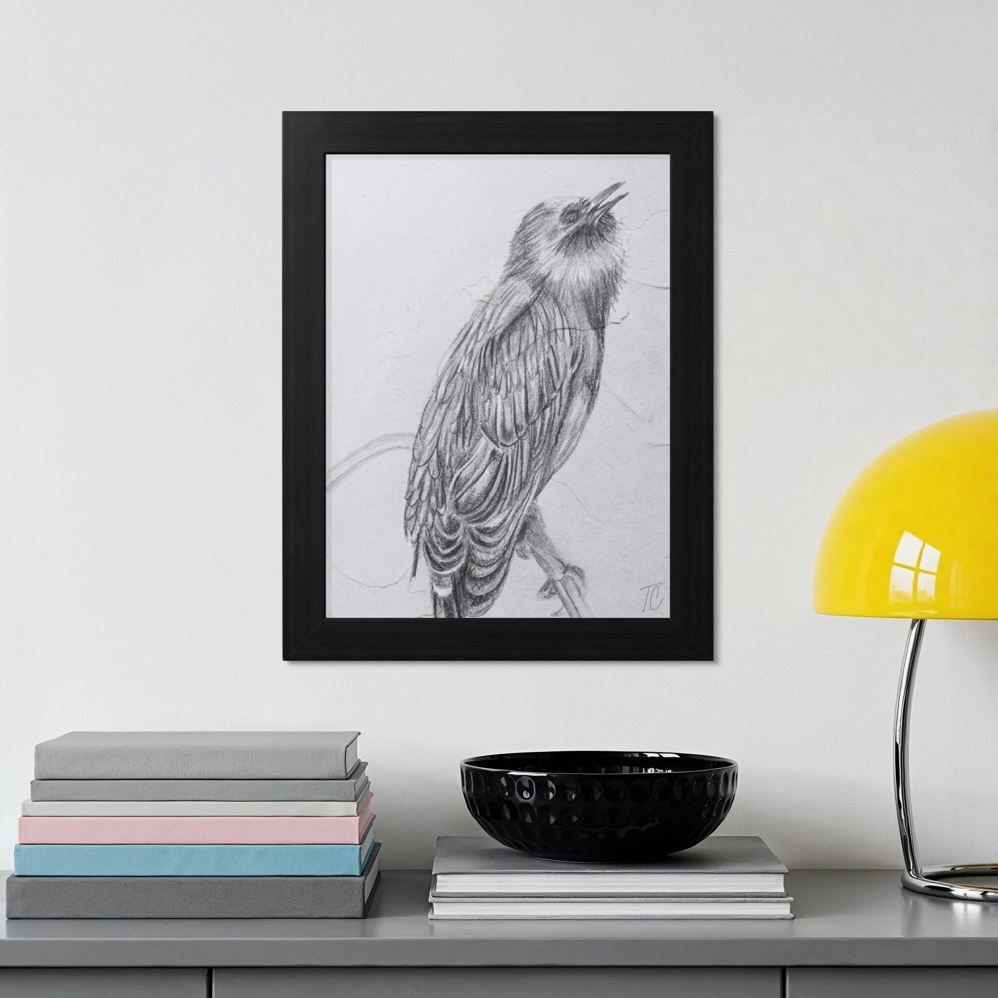 Pencil sketch of a bird perched on a branch, framed in black.
