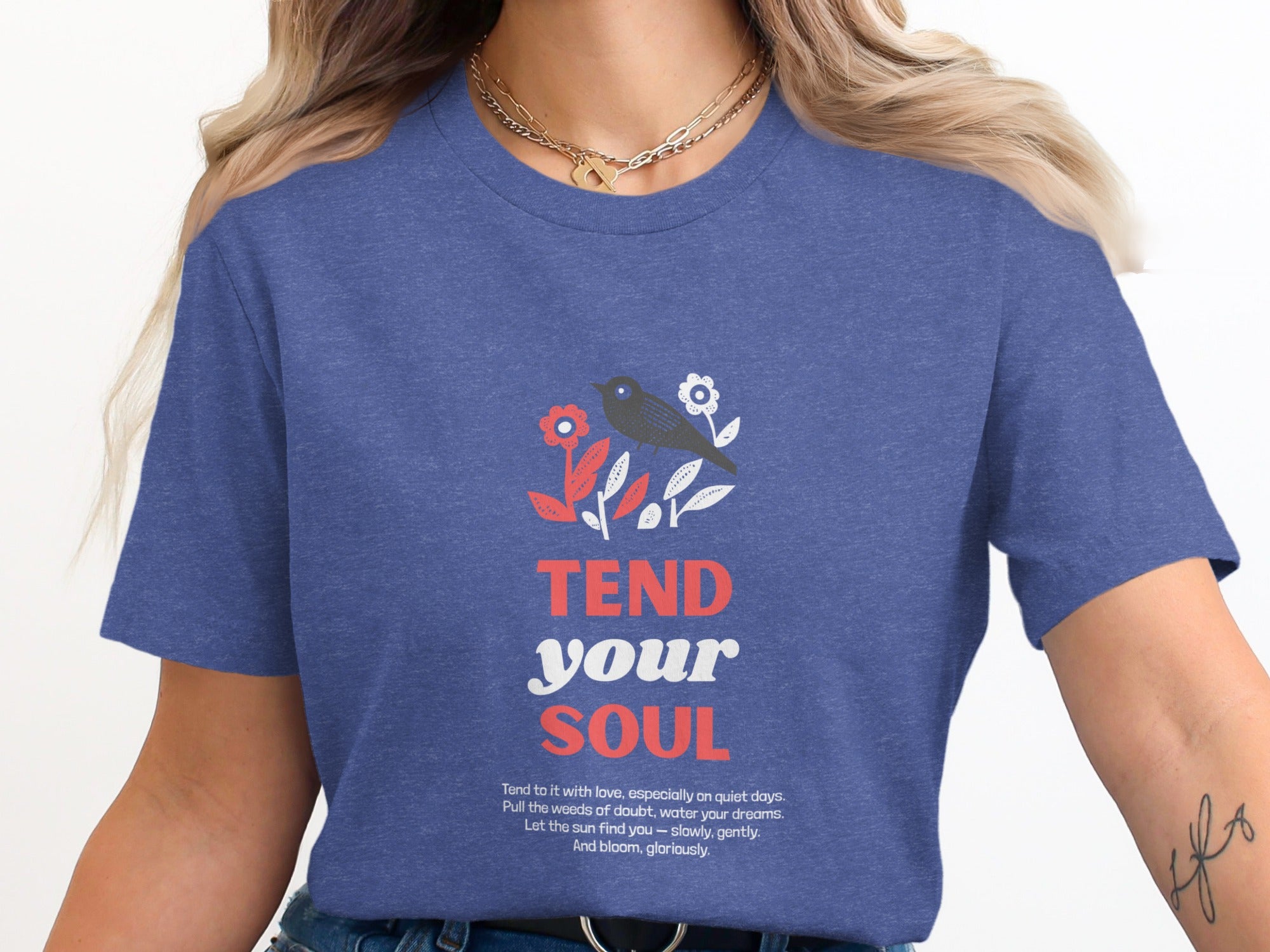 T-shirt with "Tend your soul" text and floral illustration.