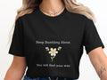 Black t-shirt with white text "Keep Bumble About. You will find your way." and bee graphics.