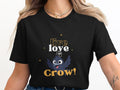Black t-shirt with "live & crow" text and cartoon crow graphic.
