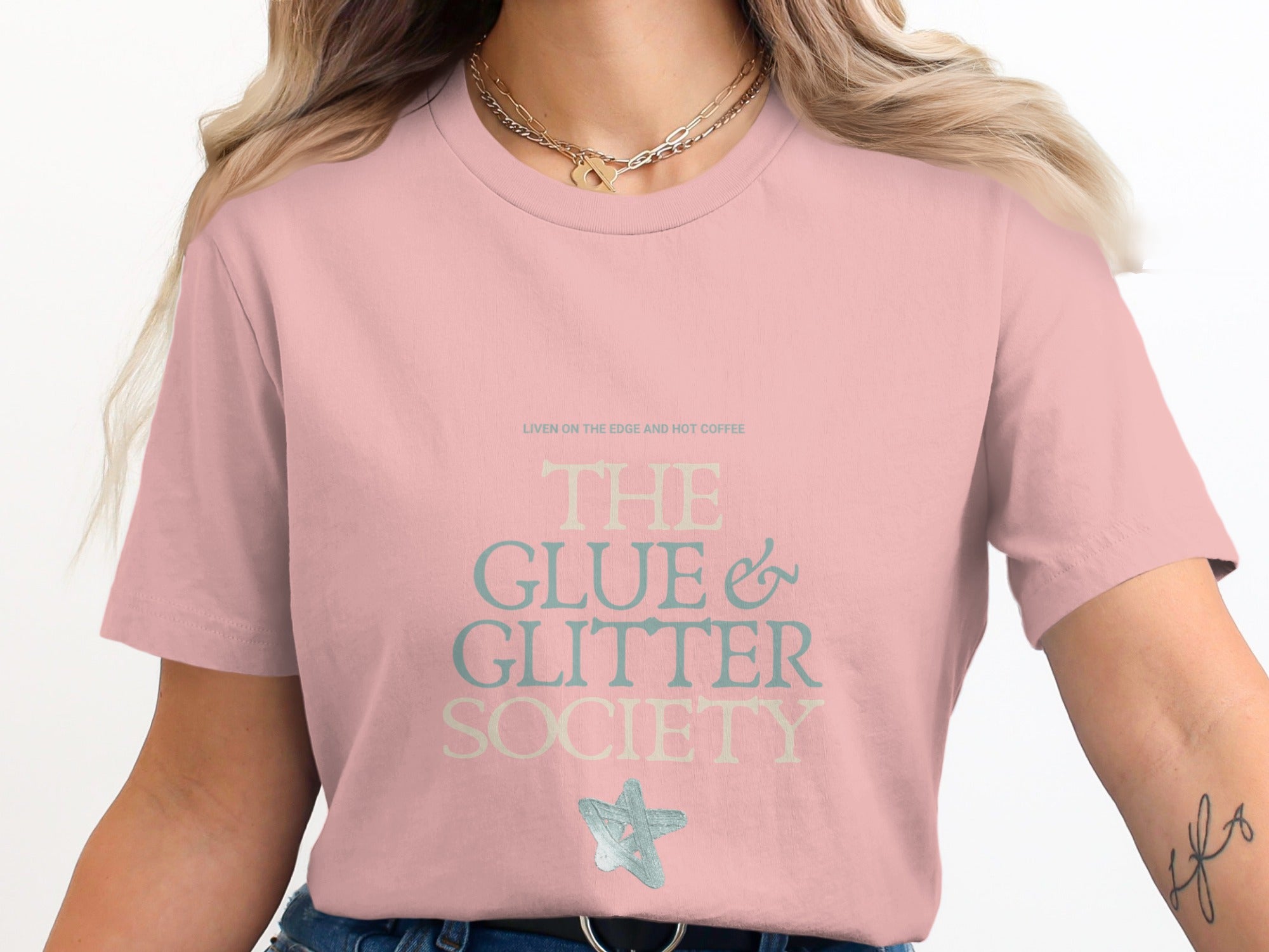 Pink t-shirt with "The Glue & Glitter Society" text and a star.