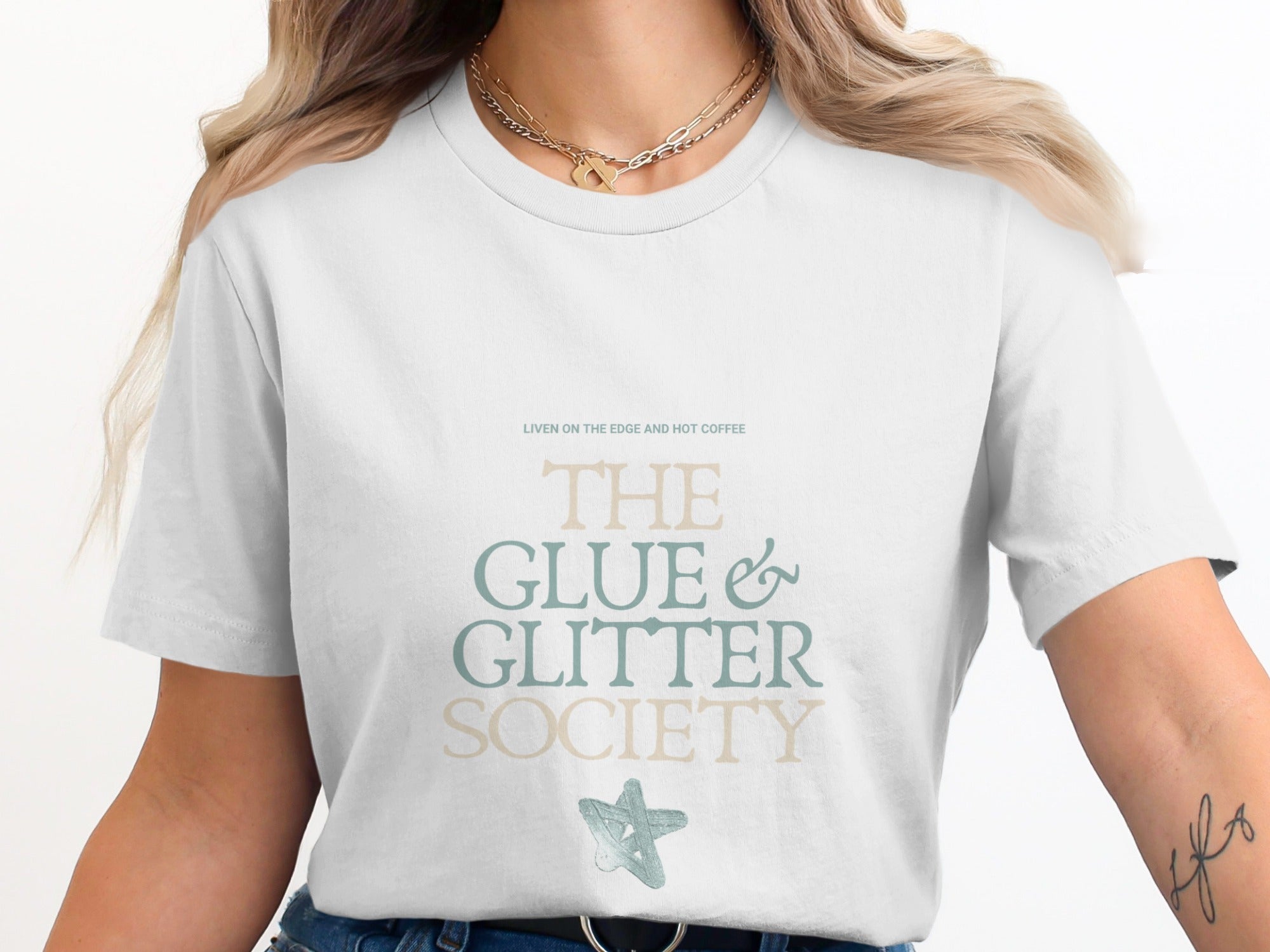 White t-shirt with "The Glue & Glitter Society" text and a star graphic.