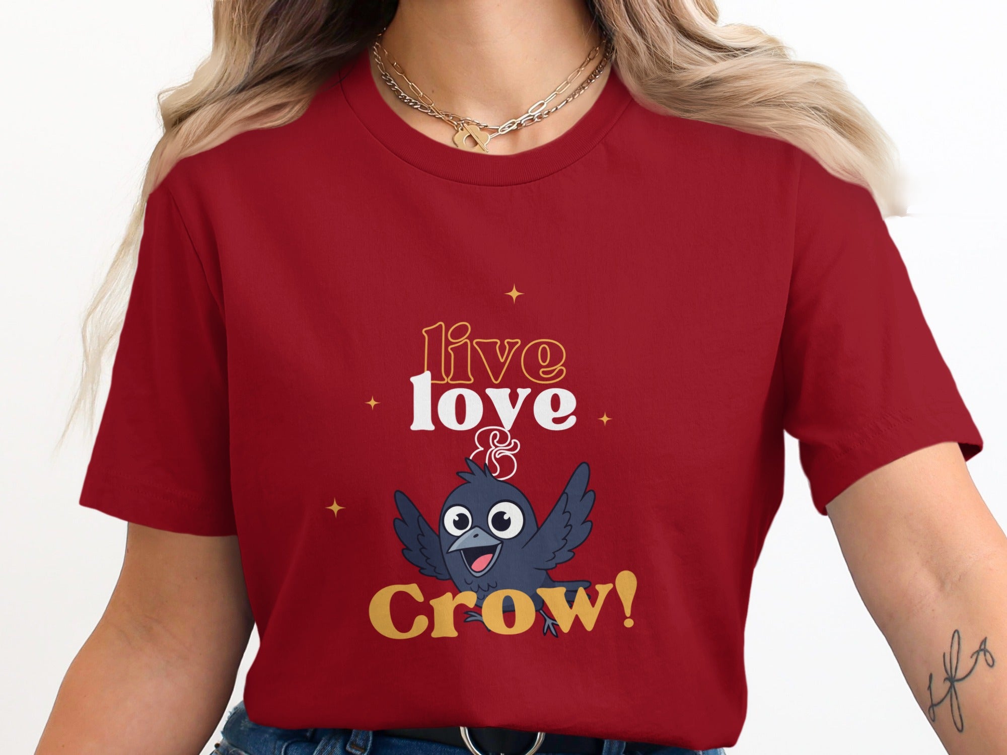 Red t-shirt with "live & Crow!" text and cartoon crow graphic.