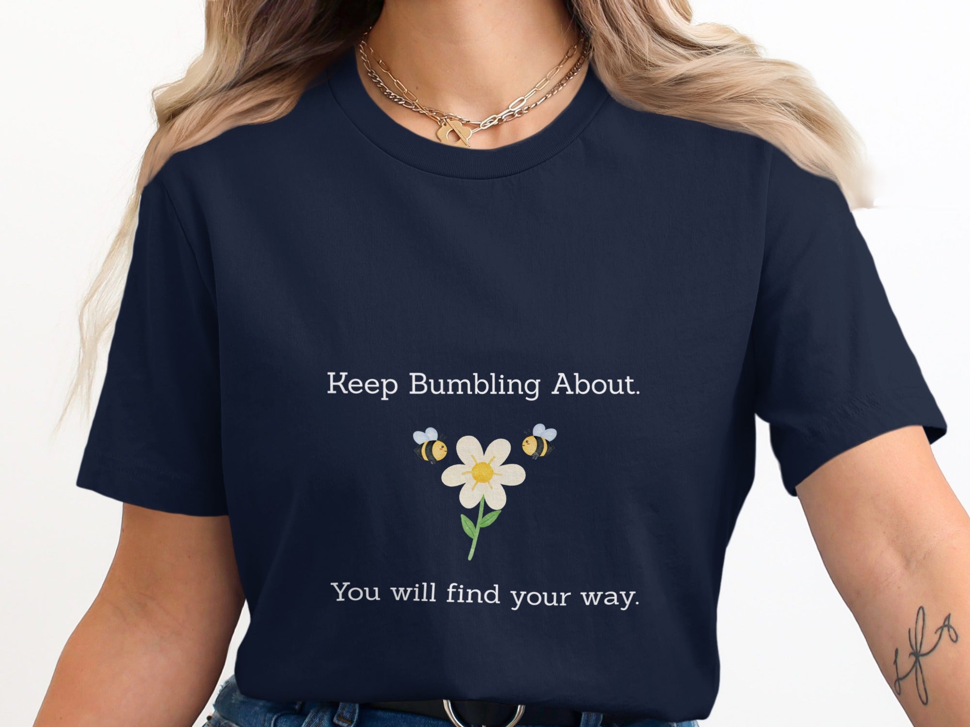 Dark blue t-shirt with white text "Keep Bumbling About. You will find your way."