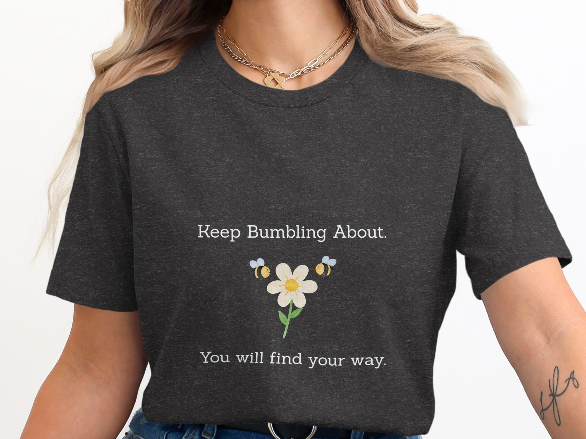 Dark t-shirt with bees and flower graphic, text "Keep Bumbling About. You will find your way."