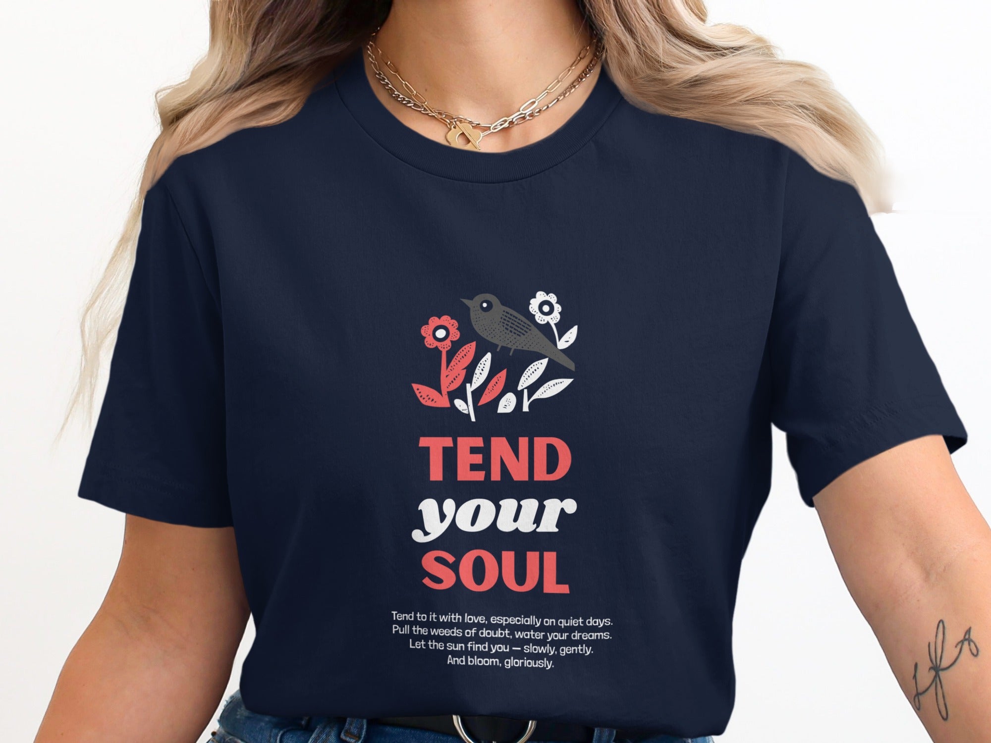 Navy t-shirt with "TEND your SOUL" and motivational text.