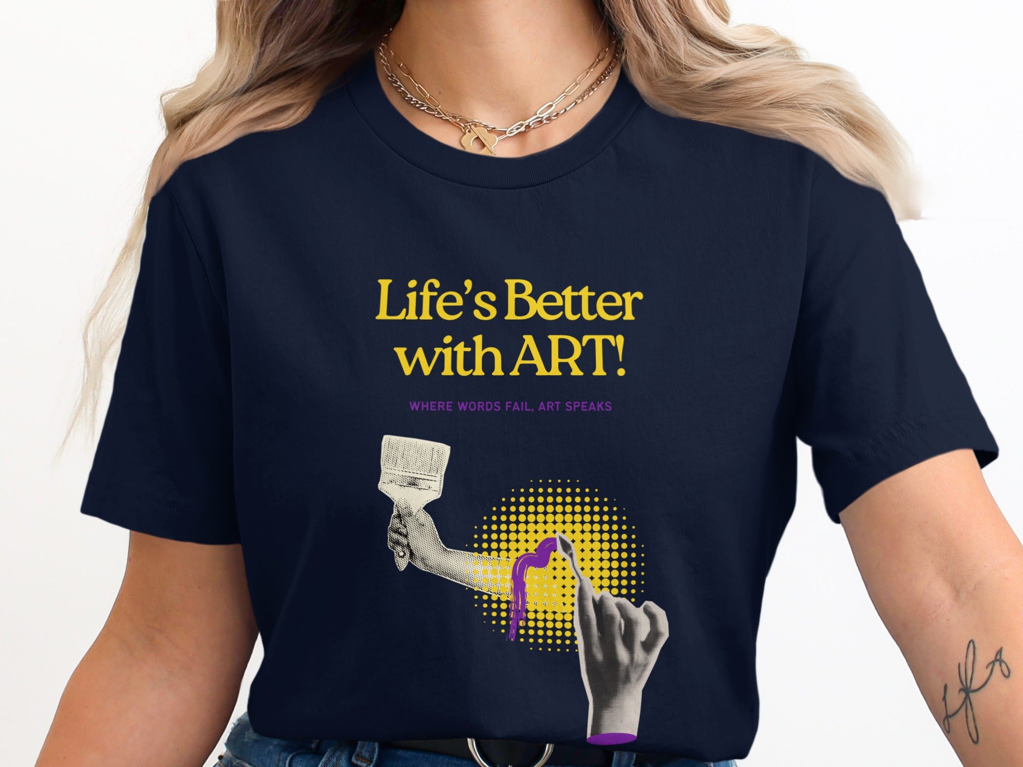 Navy t-shirt with "Life's Better with Art!" text and a hand holding a paintbrush.