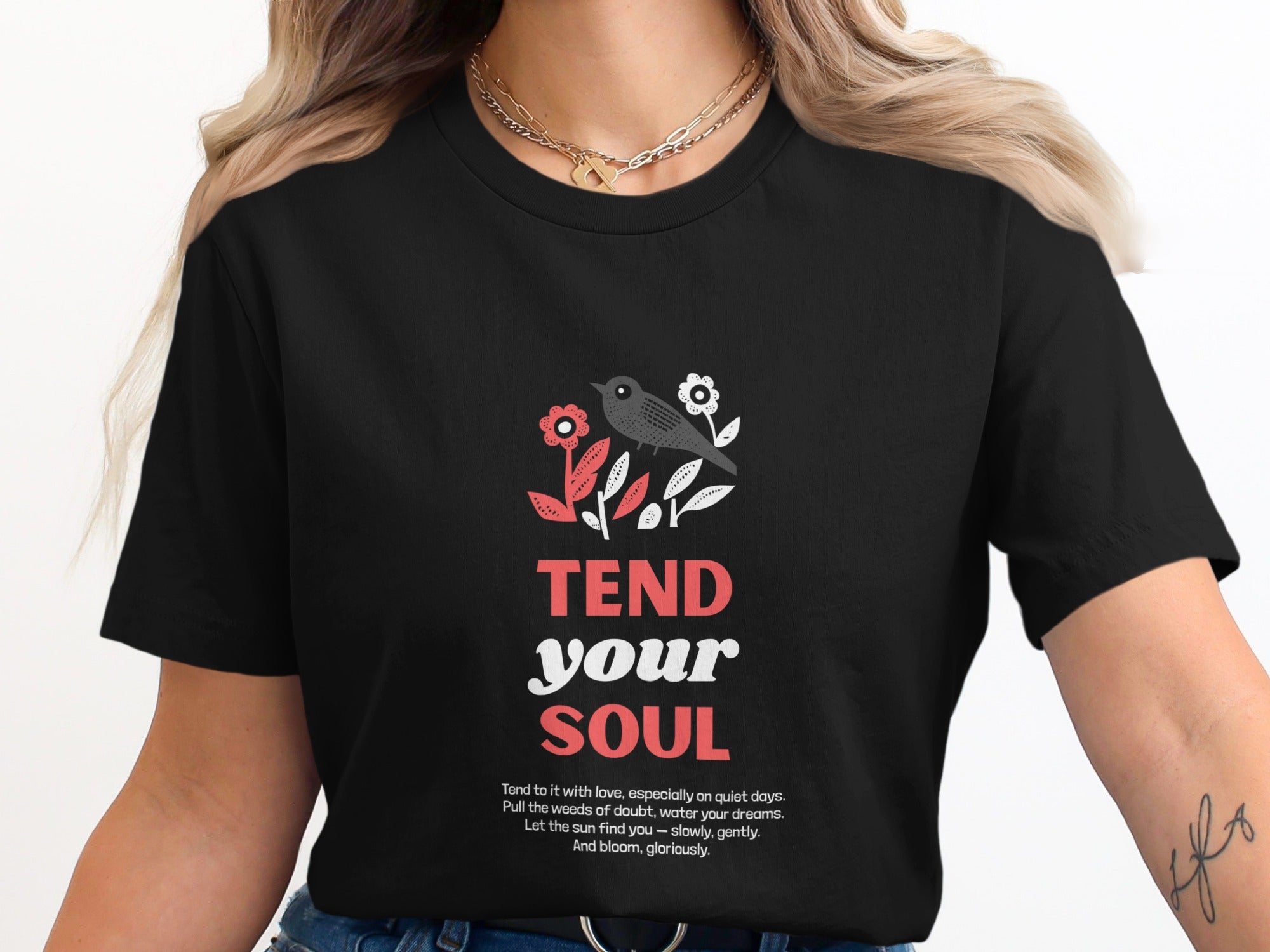Black t-shirt with "TEND your SOUL" text, flowers, and a bird graphic.
