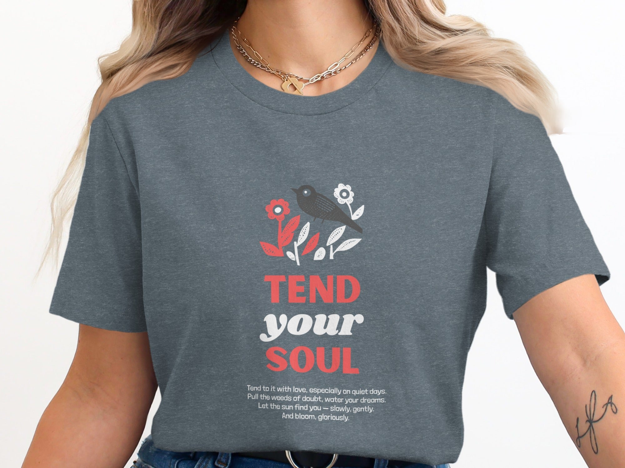 T-shirt with "TEND your SOUL" text and floral bird design.
